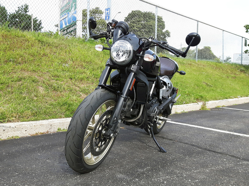 Ducati scrambler cafe racer with bar end mirrors