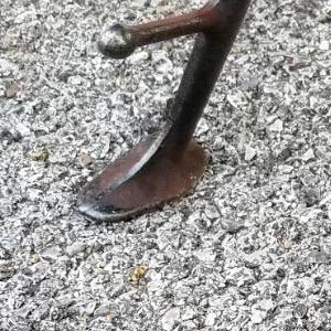 Motorcycle kickstand on pavement